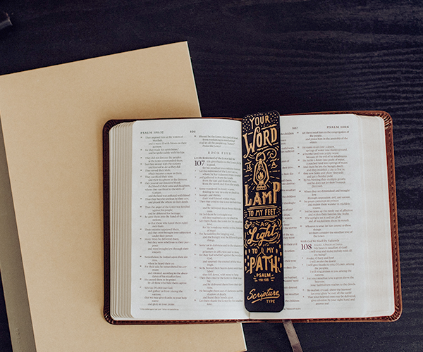 Open Bible with a bookmark and notebook